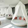 Relaxation area with hanging armchairs and cushions in the spa of the Hotel Steigenberger Krems.