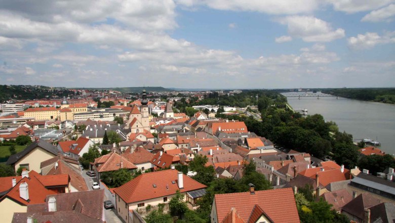 Panoramic view of the rooftops of Krems with the river and bridge in the background.