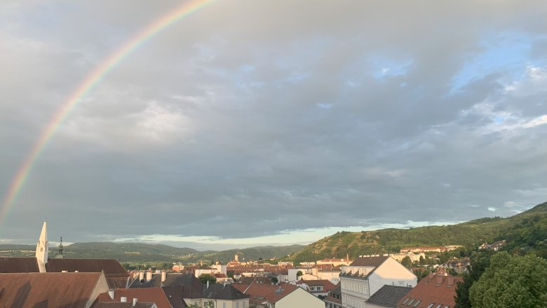 City view of Krems with rainbow in the sky.
